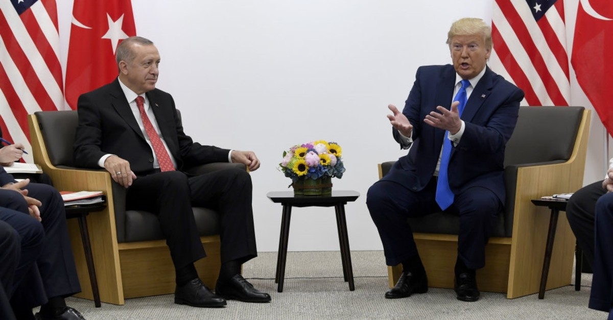 President Recep Tayyip Erdou011fan (L) meets with U.S. President Donald Trump during a meeting on the sidelines of the G20 summit in Osaka, Japan, June 29, 2019.