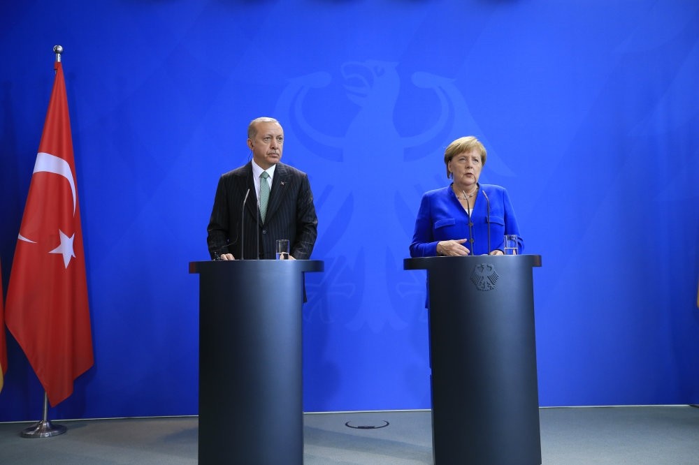 President Erdou011fan (L) and German Chancellor Angela Merkel during a press conference in Berlin, Sept. 28.