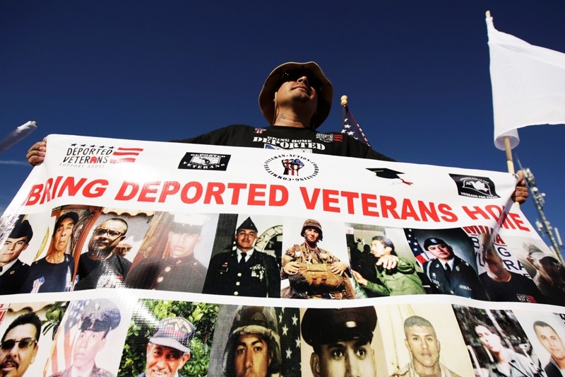Mexican veteran soldier Ivan Icon, who said he served in the U.S Army in Vietnam and Iraq under the promise of becoming a citizen but ended up as deportee, protests at the border between the U.S. and Mexico during Veterans Day ( Reuters Photo)