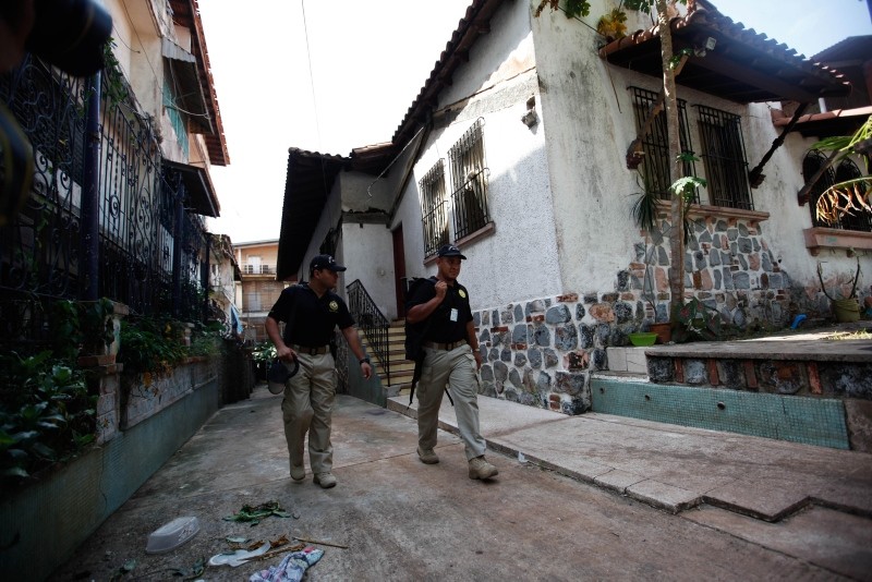 Panamanian authorities observe a house during anti human trafficking operation in Panama City, Panama (EPA Photo)