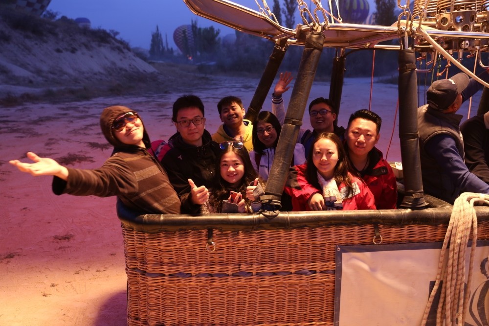 Chinese toursits seen in a hot-air balloon in Turkey's Cappadocia, famous for its fairy chimneys, underground cities and rock-carved monasteries.