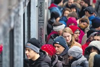 Tourists line up to enter the Anne Frank House in Amsterdam. A record 1,295,585 people visited the Anne Frank House last year, the seventh consecutive year the popular museum broke its visitor record.