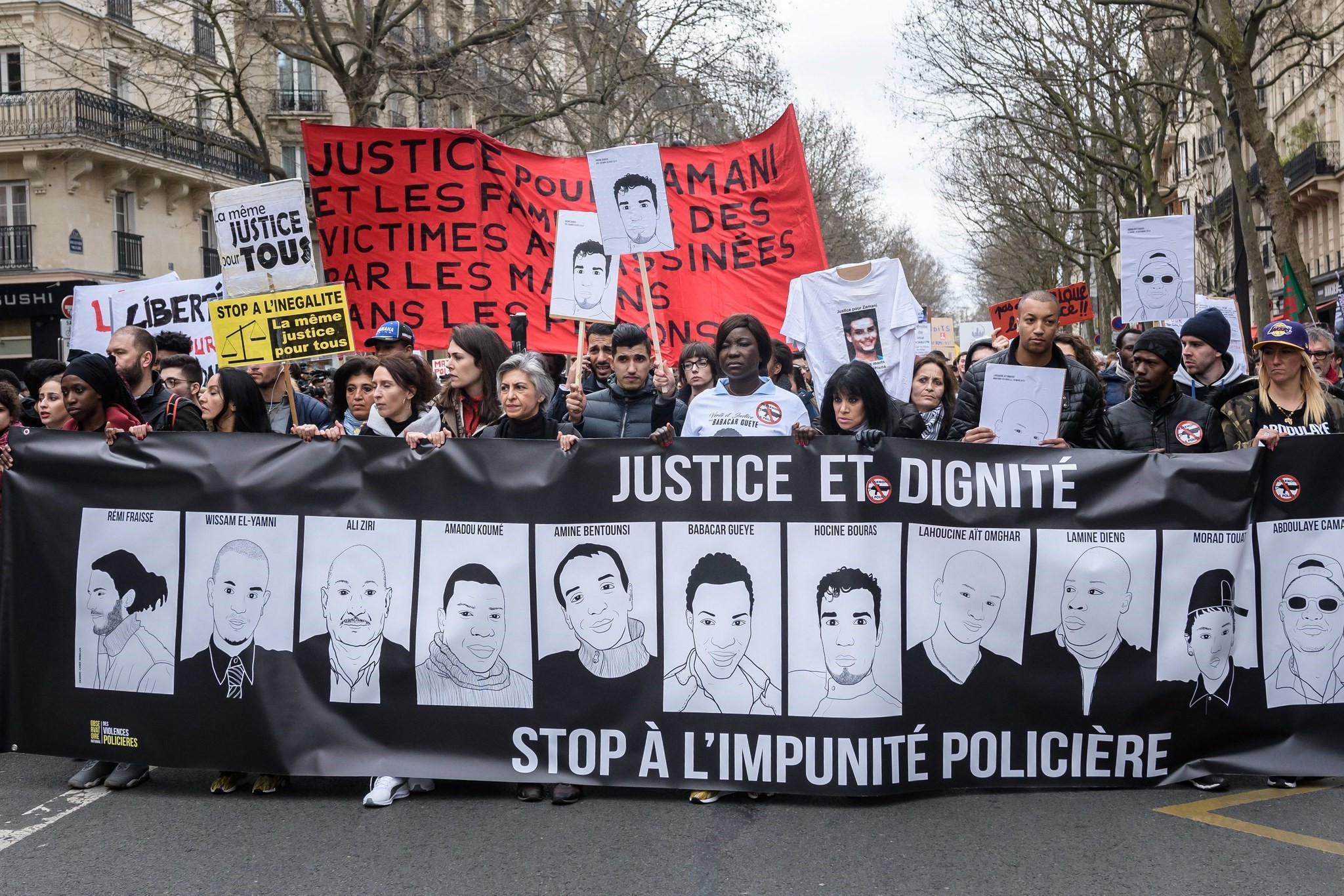 Demonstrators march with posters of their relatives killed or injured during a protest against police's violence in Paris, France, 19 March 2017. (EPA Photo)