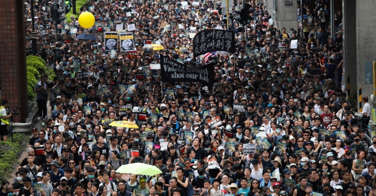 Protesters march through the Sha Tin District in Hong Kong, Sunday, July 14, 2019. (AP Photo)