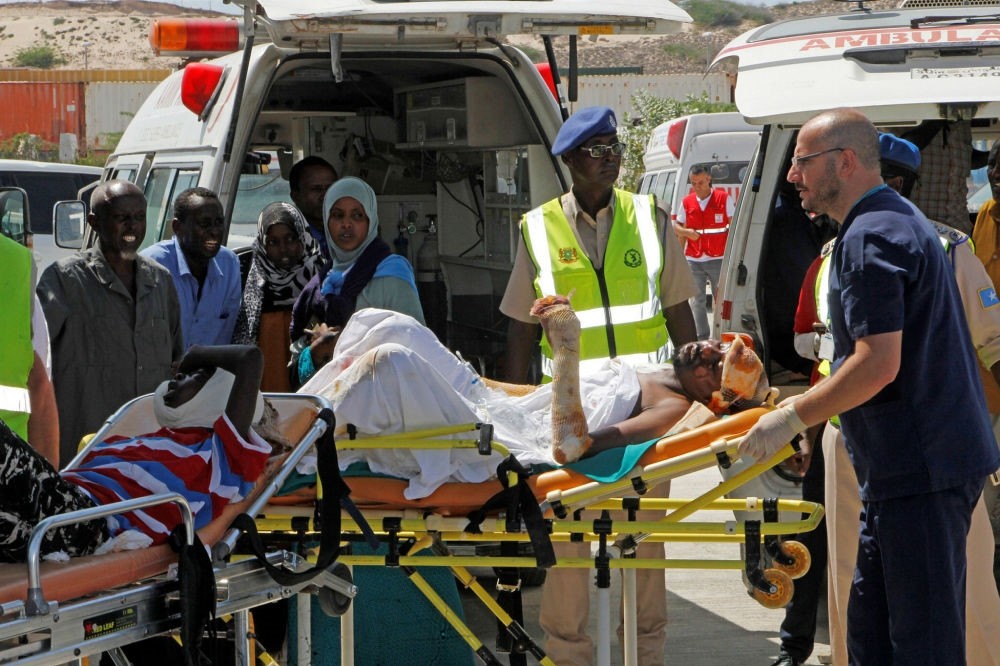 Turkish doctors transport a critically wounded man on a stretcher to a waiting Turkish air ambulance, Mogadishu, Somalia, Oct. 16.