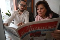 Karen Sarhon (R), the editor of the El Amaneser monthly, published entirely in Judeo-Spanish, works on a new edition of the newspaper, Istanbul, Dec. 12, 2019. (AFP Photo)