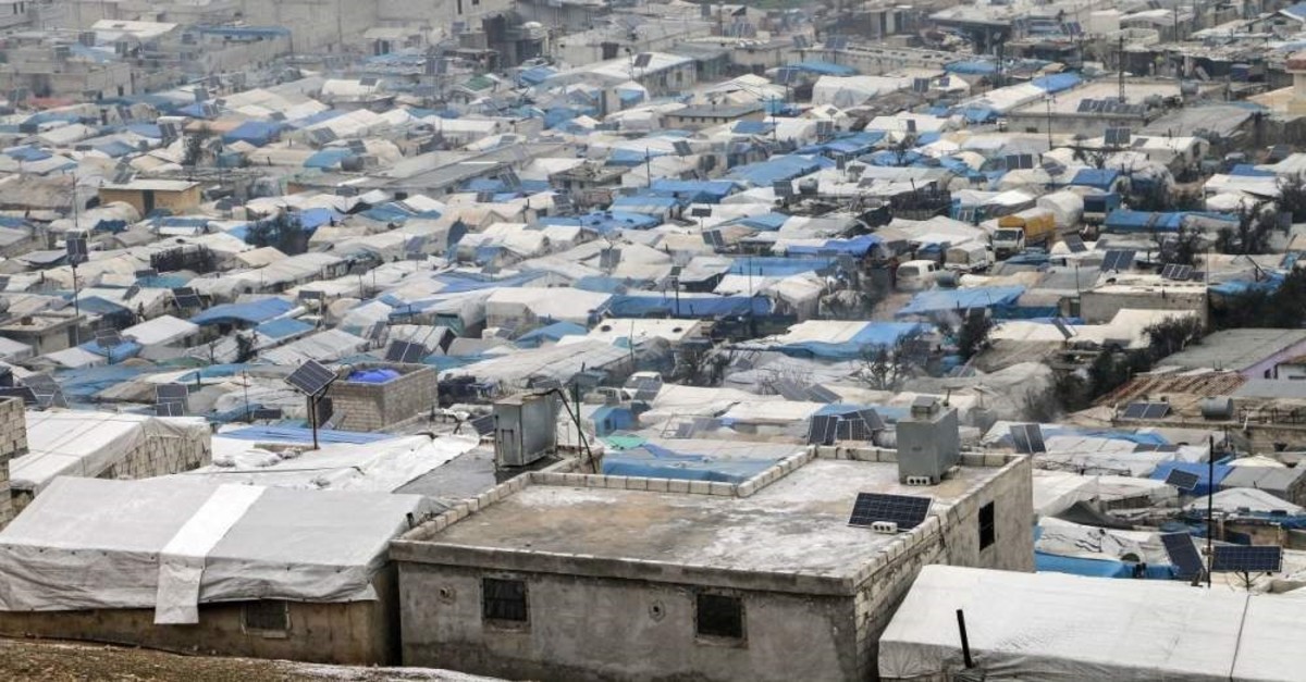Civilians trying to survive the harsh winter conditions in poor tents are still having a difficult time after fleeing the attacks of Russia and the Assad regime, Feb. 13, 2020. (AA Photo)