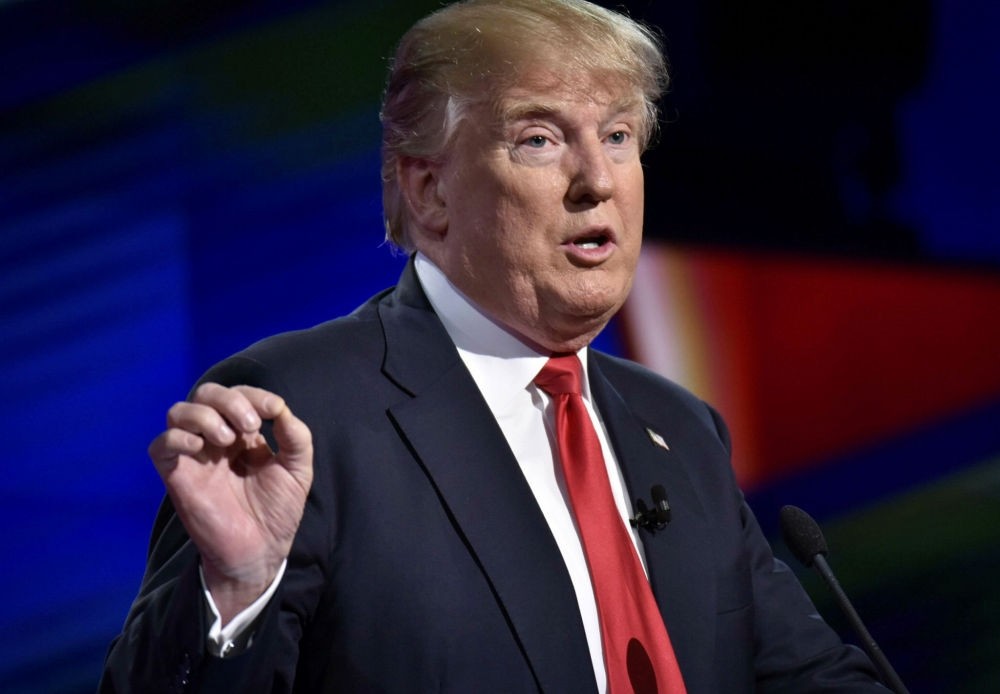 U.S. President Donald Trump gestures as Republican presidential candidate during the Republican National Committee Presidential Primary Debate at the University of Miami's Bank United Center, in USA.