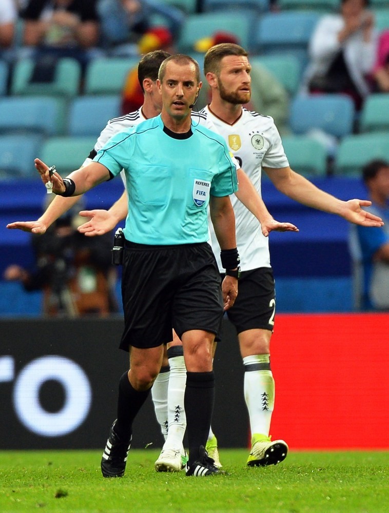 Referee Mark Geiger of the U.S. waits for a video assistant referee (VAR) decision during the FIFA Confederations Cup 2017 group B match between Australia and Germany.
