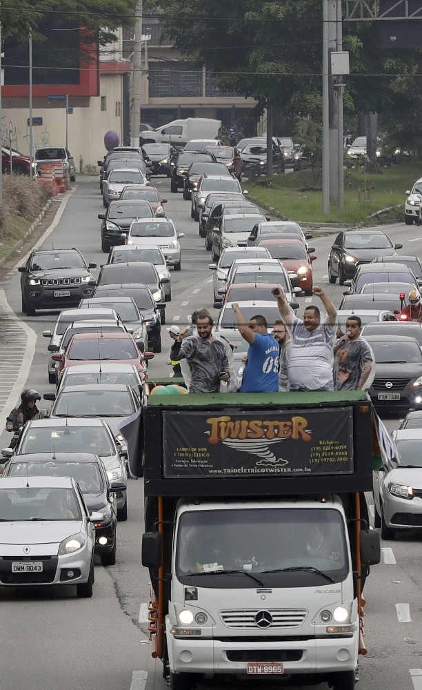Uber drivers and other ride-sharing apps, protest against proposed regulation of those services by the Brazilian Senate.