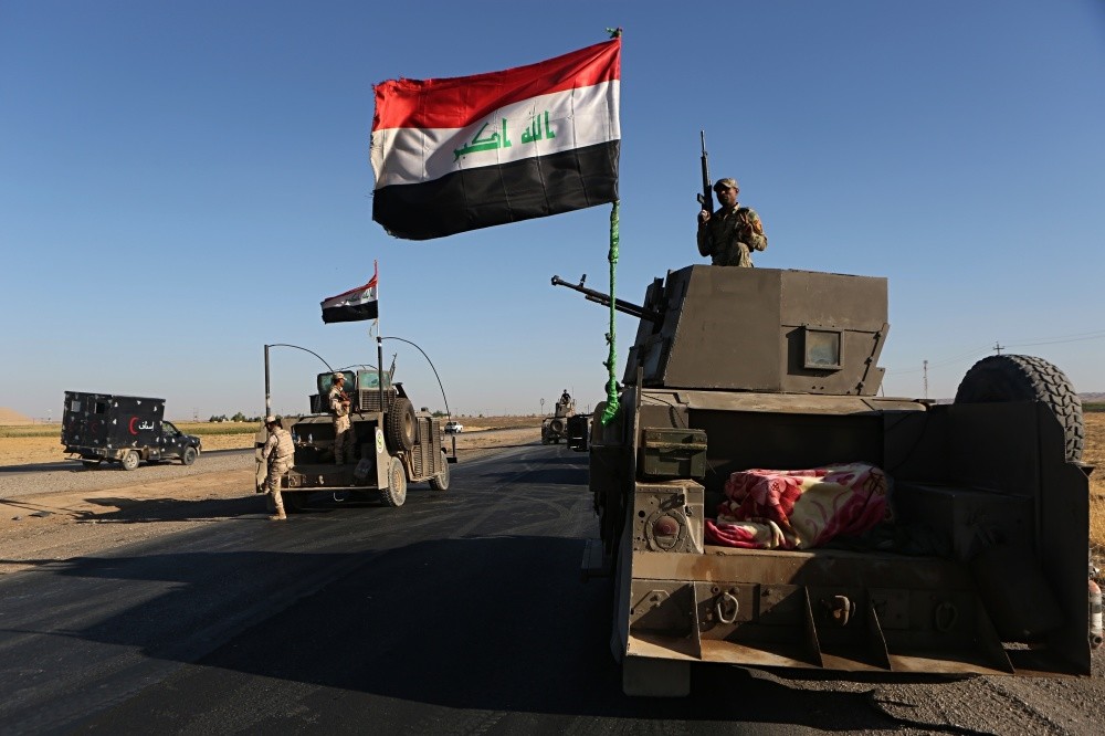 Iraqi military forces gather outside Altun Kupri, outside Irbil, Iraq, Oct. 19. 