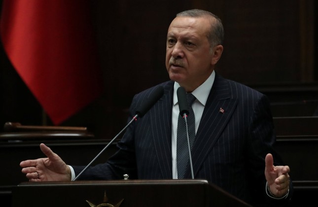 President Recep Tayyip Erdoğan addresses parliamentarians from the AK Party during a meeting at the Turkish Parliament in Ankara, yesterday.