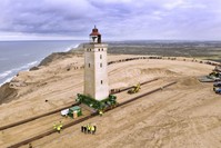 The Rubjerg Knude Lighthouse is being moved on tracks in Jutland, Denmark, Tuesday, Oct. 22, 2019. (AP Photo)