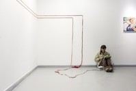 Artist Eu015fref Yu0131ldu0131ru0131m seen weaving in the exhibition area. u200b