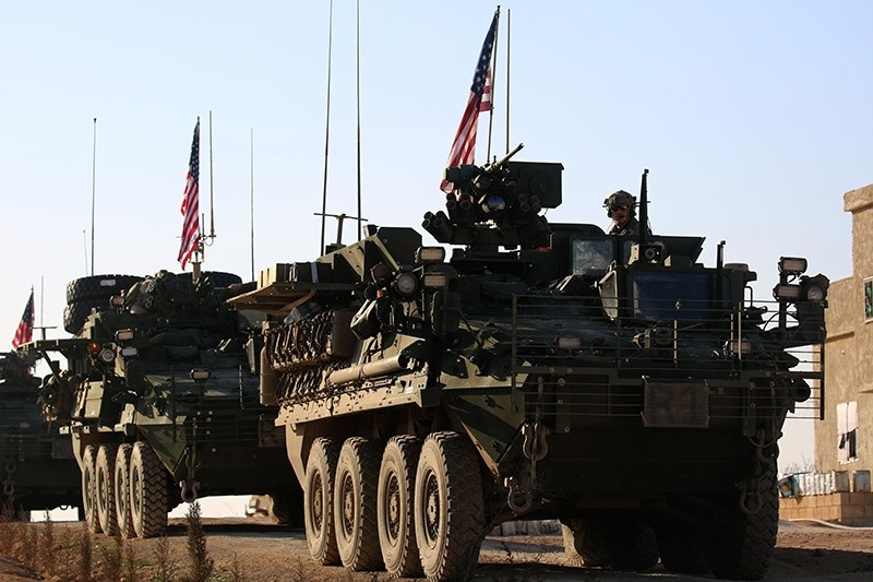 A convoy of U.S. forces armored vehicles drives near the village of Yalanlu0131, on the western outskirts of the northern Syrian city of Manbij, on March 5, 2017. (AFP Photo)