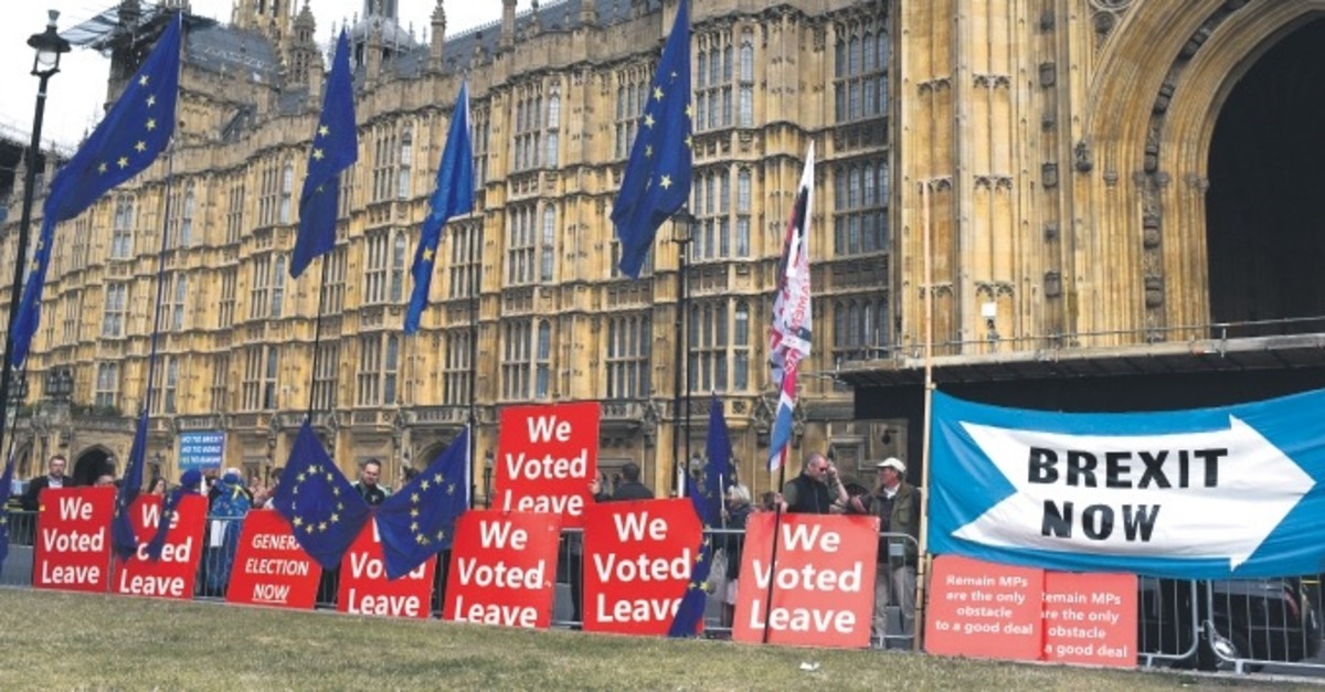 Pro-Brexit placards and EU flags are pictured outside the Houses of Parliament in London, Sept. 5, 2019.