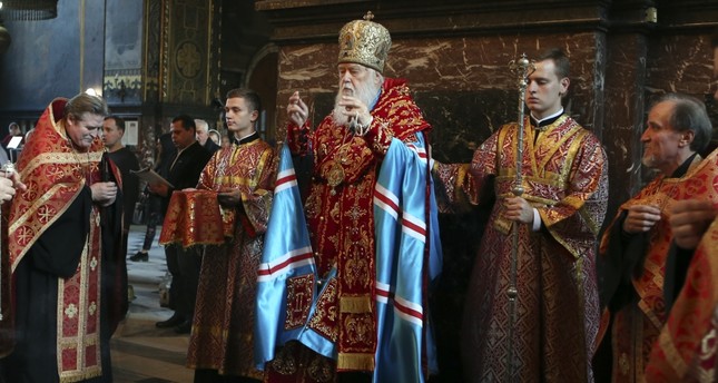 Patriarch Filaret, head of the Ukrainian Orthodox Church of the Kiev Patriarchate, conducts a service at the St. Volodymyr's Cathedral in Kiev, Ukraine, Oct. 11.