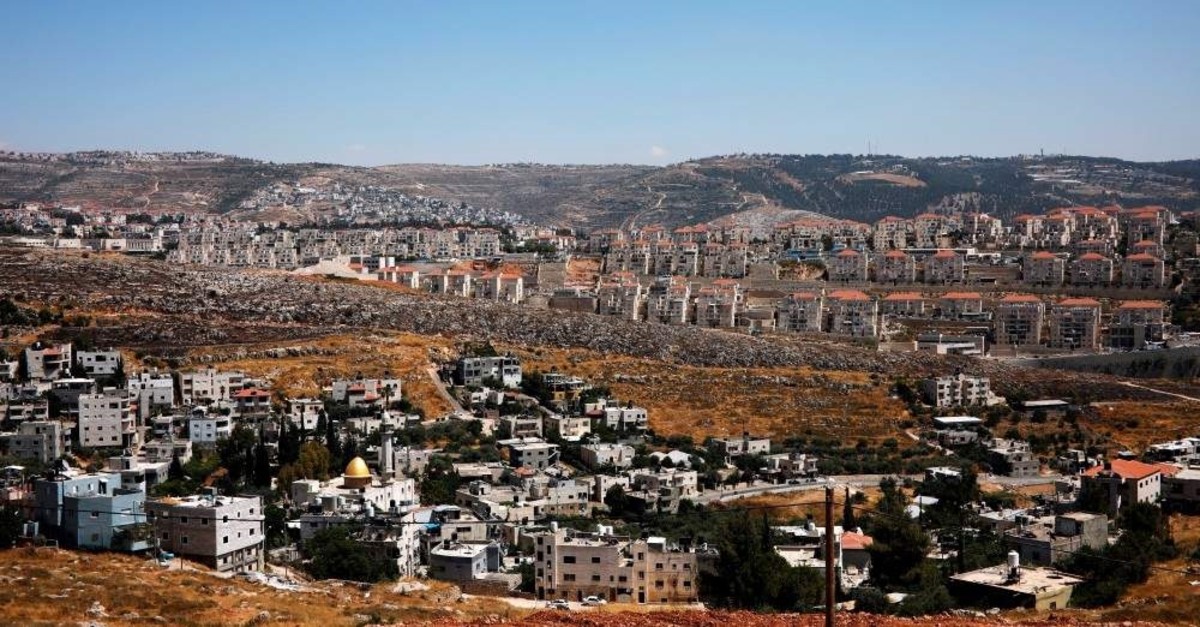 A view of Palestinian houses in the village of Wadi Fukin with the Israeli settlement of Beitar Illit in the background, the occupied West Bank, June 19, 2019. REUTERS