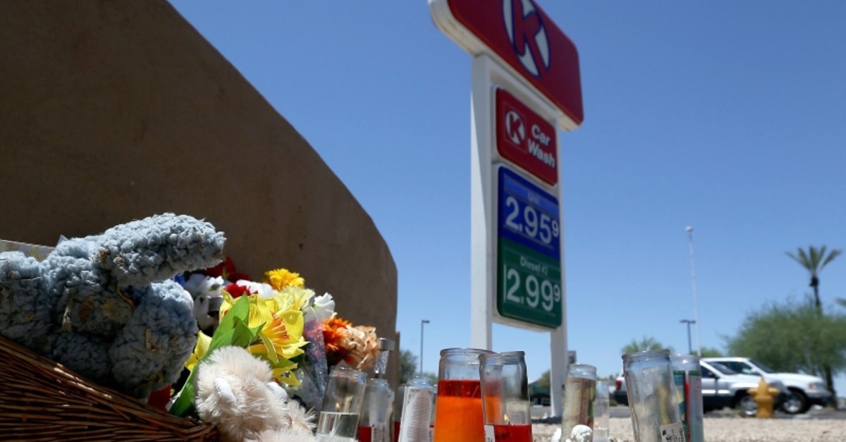 A makeshift memorial for Elijah Al-Amin is set up at a local Circle K store for the death of the stabbing victim Tuesday, July 9, 2019, in Peoria, Ariz.(AP Photo)