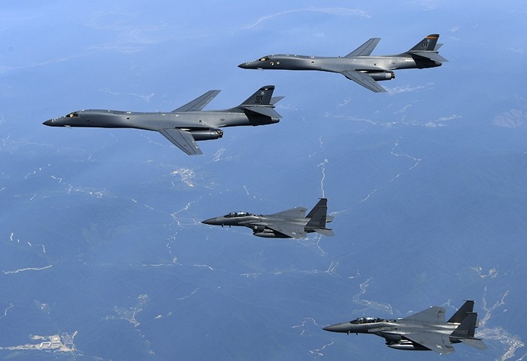 In this June 20, 2017 file photo from South Korean Defense Ministry, U.S. Air Force B-1B bombers and South Korean fighter jets F-15K fly over the Korean Peninsula, South Korea. (AP Photo)
