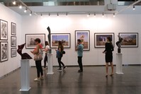 People visit an exhibition at the Contemporary Istanbul art fair, u015eiu015fli, Istanbul.