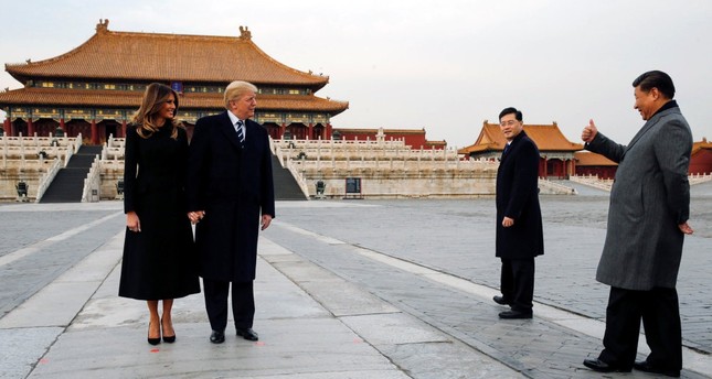 U.S. President Donald Trump and his wife first lady Melania Trump (L) visit China's Forbidden City with Chinese President Xi Jinping (R), Beijing, November 2017.