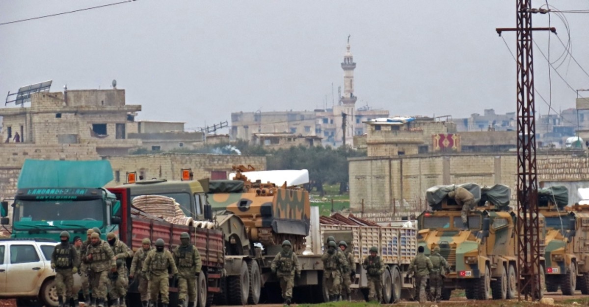 Turkish military vehicles are pictured in the town of Binnish in Syriau2019s northwestern province of Idlib, near the Syria-Turkey border on Feb. 12, 2020 (AFP Photo)