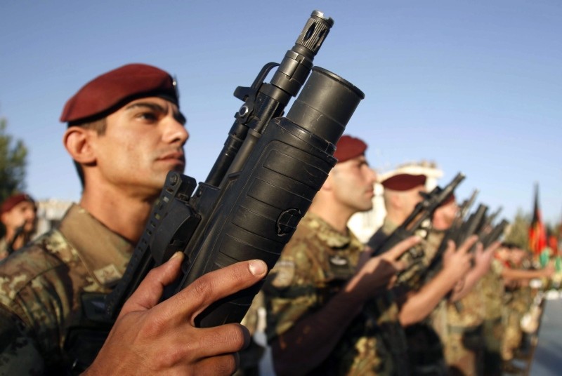 Italian soldiers with the NATO-led International Security Assistance Force (ISAF) stand during a changing command ceremony at the Provincial Reconstruction Team compound run by the Italian military in Herat, Afghanistan, Oct. 12, 2009. (AP Photo)