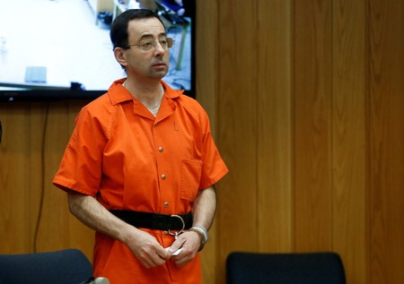Larry Nassar, a former team USA Gymnastics doctor who pleaded guilty in Nov. 2017 to sexual assault charges, stands in court during his sentencing hearing in the Eaton County Court in Charlotte, February 5, 2018.