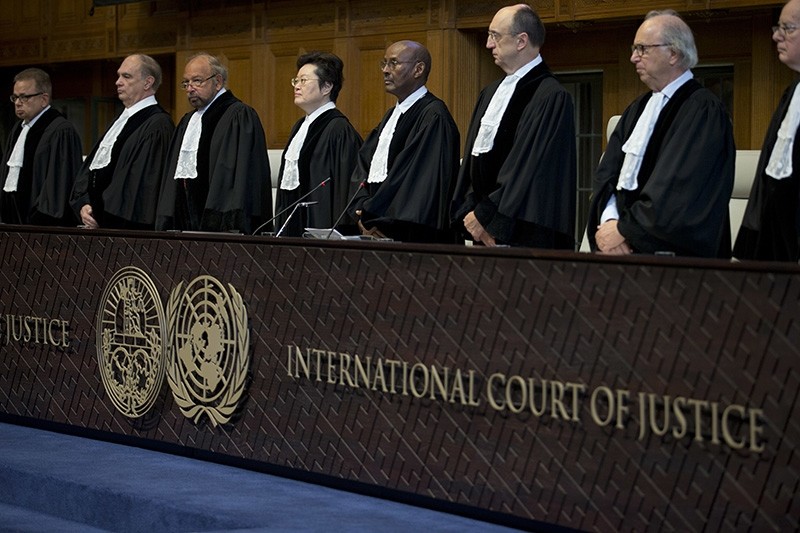 Judges enter the International Court of Justice, or World Court, in The Hague, Netherlands, Wednesday, Oct. 3, 2018, where they ruled on an Iranian request to order Washington to suspend U.S. sanctions against Tehran. (AP Photo)