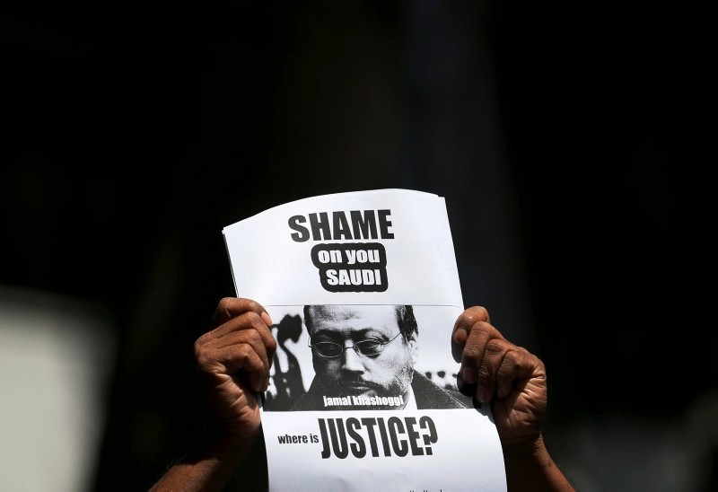 A member of Sri Lankan Web Journalist Association holds a placard during a protest condemning the murder of slain journalist Jamal Khashoggi in front of the Saudi embassy in Colombo, Sri Lanka, October 25, 2018. (Reuters Photo)