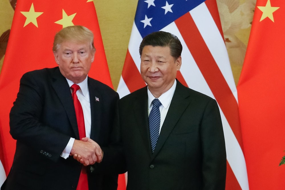 U.S. President Trump (L) and Chinese President Xi (R) shake hands during a press conference at the Great Hall of the People, Beijing, China, Nov. 9.