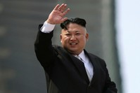 North Korean leader Kim Jong Un waves during a military parade to celebrate the 105th birth anniversary of Kim Il Sung in Pyongyang, North Korea on April 15.