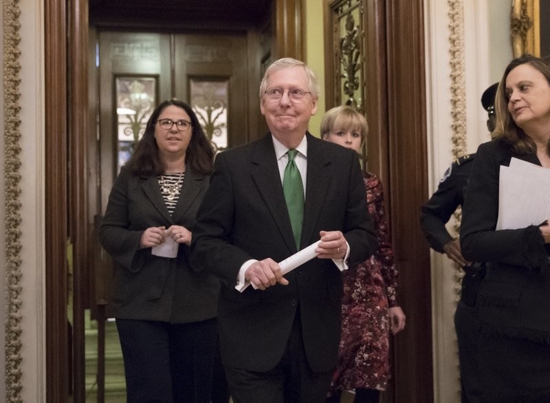 Senate Maj. Leader Mitch McConnell, R-Ky, leaves the chamber after announcing an agreement in the Senate on a 2-year, almost $400 BN budget deal that would provide Pentagon and domestic programs with huge spending increases, at the Capitol (AP Photo)