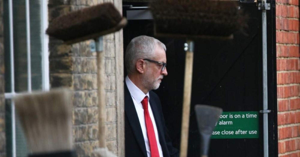 Britain's opposition Labour Party leader Jeremy Corbyn leaves Islington Town Hall through the backdoor after a meeting following the results of the general election in London, Britain, December 13, 2019. (REUTERS Photo)