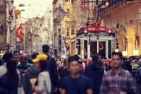 A tram passes through the large crowded Istiklal Street in Taksim, Istanbul. (iStock Photo / Damir Cudic)