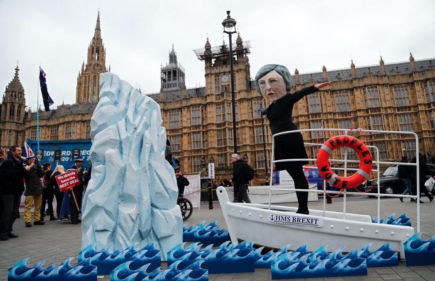An activist wears a mask of Britainu2019s Prime Minister Theresa May during an anti-Brexit demonstration, in front of the Houses of Parliament, London, Jan. 15.