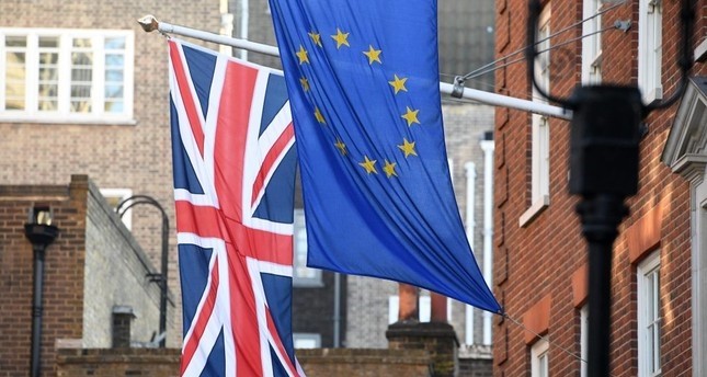  The EU and Union Jack flags fly side by side outside the Europa House in Westminster, London. 