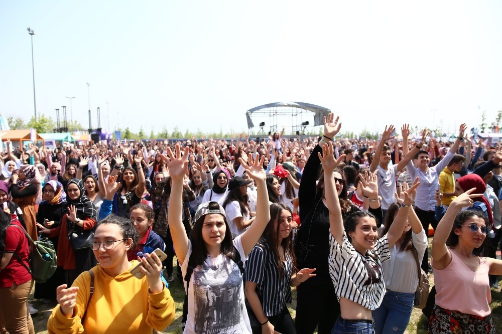 People enjoying a concert on the first day of the festival.