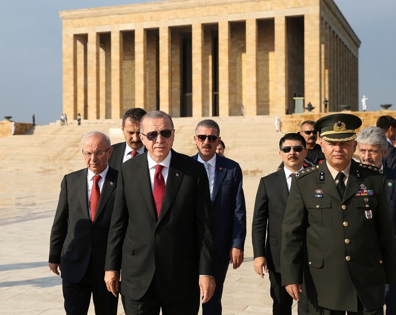 Erdoğan walks following a wreath-laying ceremony at Anıtkabir in Ankara, Turkey, Monday, July 9, 2018.