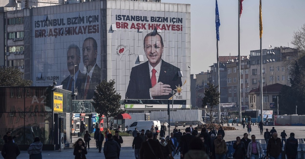 A giant campaign poster for local elections bearing a picture of President Erdou011fan and reading u201cIstanbul Is a Love Story For Usu201d covers the facade of a building, March 26, 2019. 