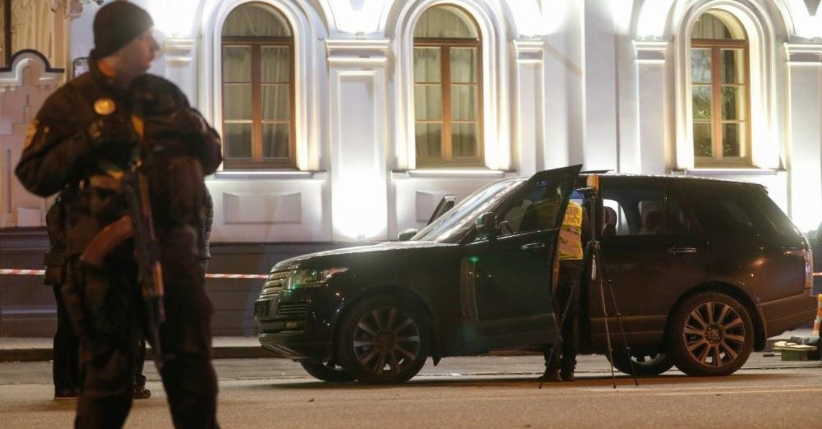 An investigator inspects a car at a site of a murder attempt on the lawmaker of the Kiev regional council and businessman Viacheslav Soboliev in Kiev, Ukraine Dec. 1, 2019.  (Reuters Photo)
