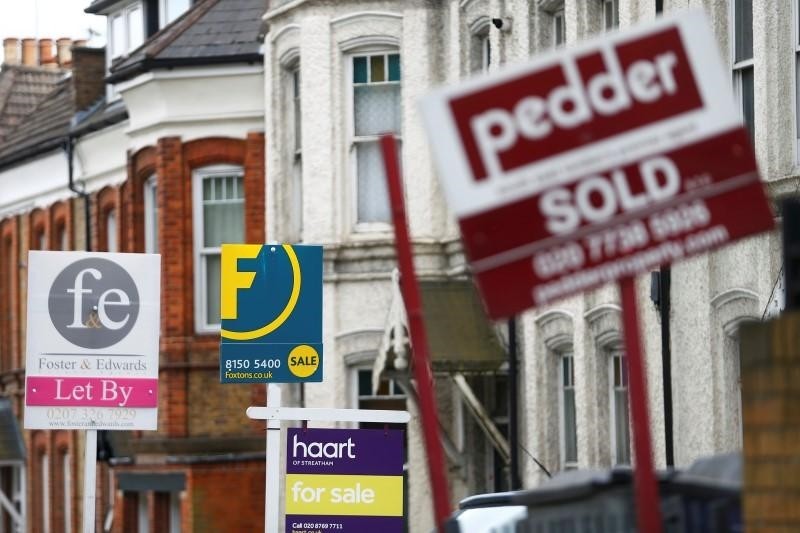 Estate agents boards are lined up outside houses in south London June 3, 2014 (Reuters File Photo)