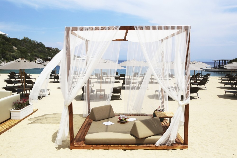 The Sands Beach Club is a summer venue with cream-colored parasols, stylish chaise lounges made of walnut and private lodges full of linen pillows just a few of the details, creating complete French elegance. 