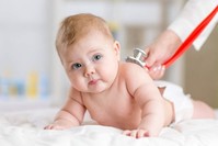 A pediatrician examines a baby with a stethoscope. (File Photo)