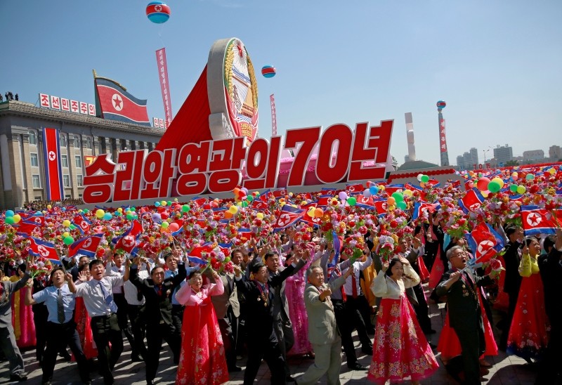 North Korean participants march with a float during a parade celebrating the National Day and 70th anniversary of its Foundation in Pyongyang, North Korea, Sept. 09, 2018. (EPA Photo)