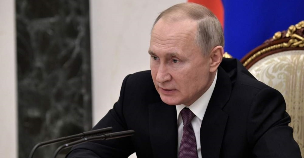 Russian President Vladimir Putin attends a meeting on economic issue in Moscow, Russia, Wednesday, Feb. 12, 2020. (Alexei Nikolsky, Sputnik, Kremlin Pool Photo via AP)