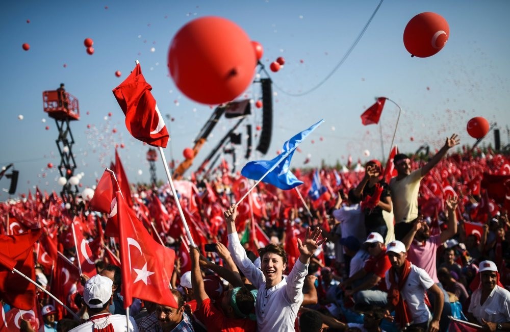 People wave Turkish flags during a rally against the July 15 coup attempt where government officials and opposition party members attended to condemn the heinous attempt, Yenikapu0131, Istanbul, Aug. 7, 2016.