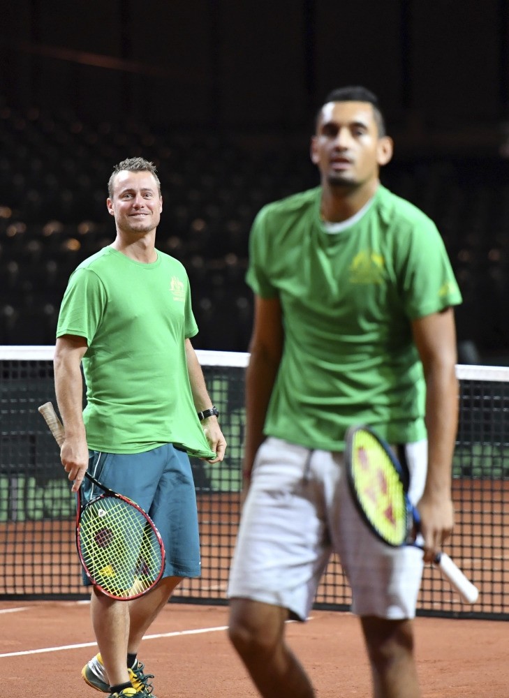 Team Australia's Nick Kyrgios (R), and team captain Lleyton Hewitt participate in a practice session prior to the Davis Cup World Group tennis semifinal in Brussels.