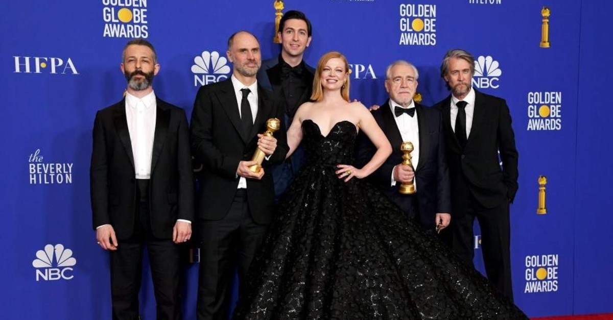 (L-R) Jeremy Strong, Jesse Armstrong, Nicholas Braun, Sarah Snook, Alan Ruck, and Brian Cox pose with the award for Best Television Series - Drama for ,Succession, during the 77th Annual Golden Globe Awards at The Beverly Hilton Hotel on January 05, 2020 in Beverly Hills, California. (AFP Photo)